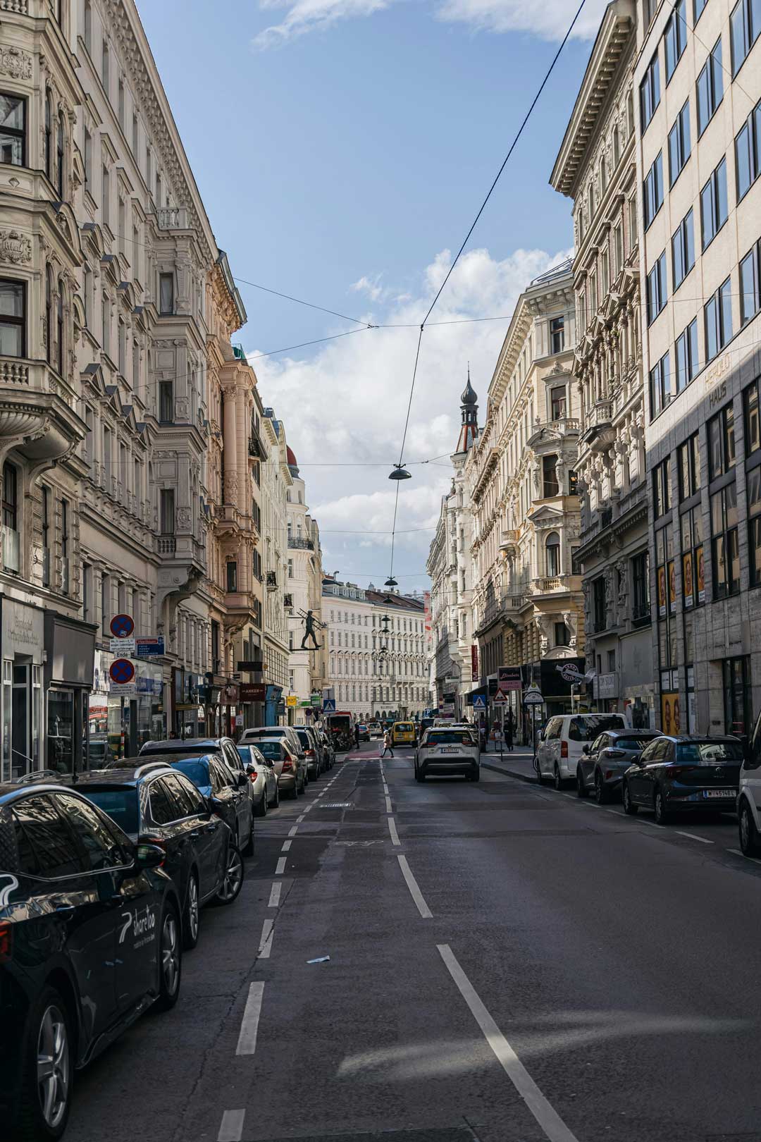 Narrow sunny street in Viennas historic old town in the 5th district