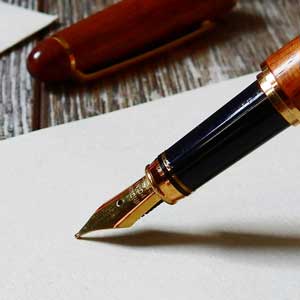 Elegant fountain pen on white paper