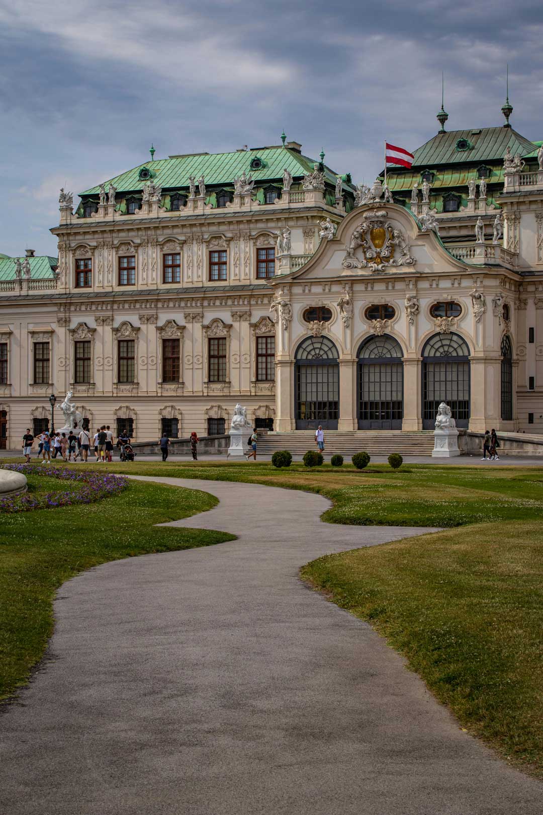 View of Belvedere with blue sky in the back and green grass in the front, in Viennas 4th district