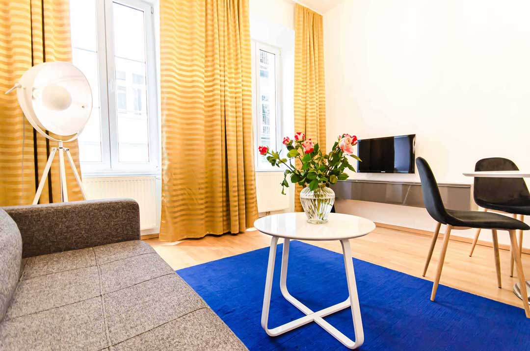 Colorful and cozy living room in furnished apartment in Vienna