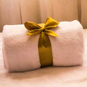 Elegant and clean towel with golden bow