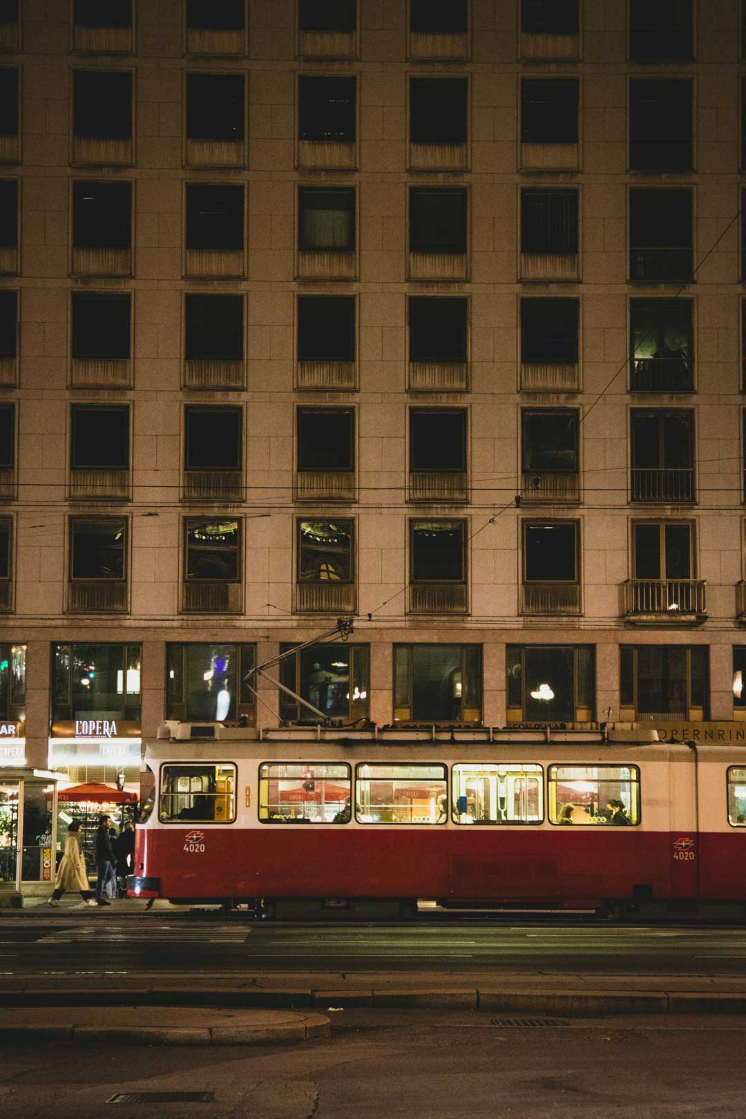 Old tram in front of a big house in Viennas 6th district - Mariahilf