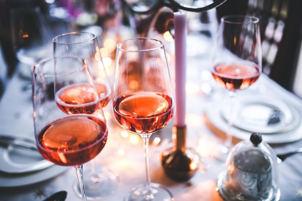 Three wine glasses with Rose inside.